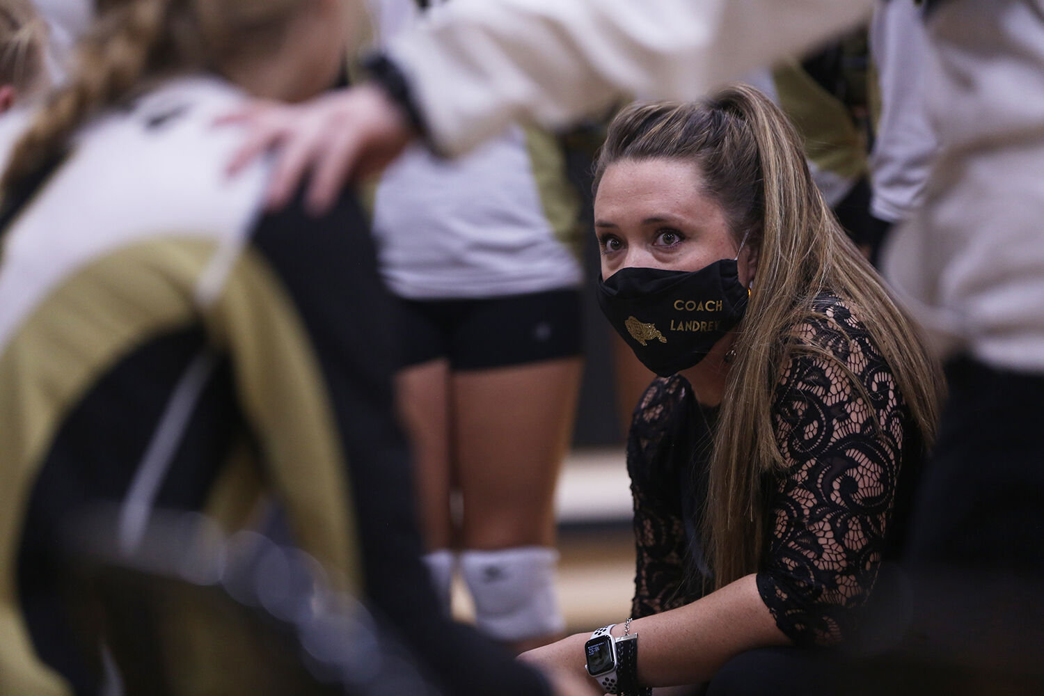 Head coach Carlene Landrey talks with her team